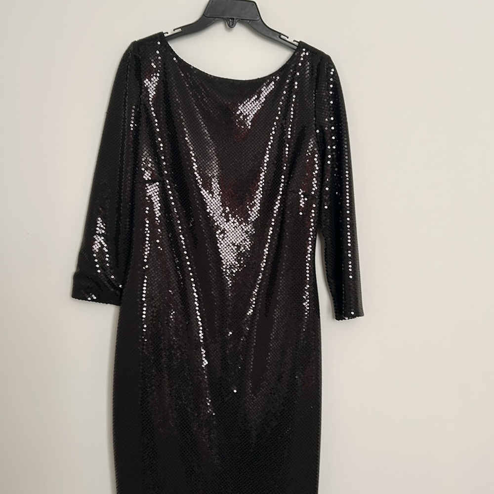 Black party dress for the holidays. Length=40 inches; armpit to armpit=19 inches